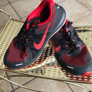 Red and black Nike shoes